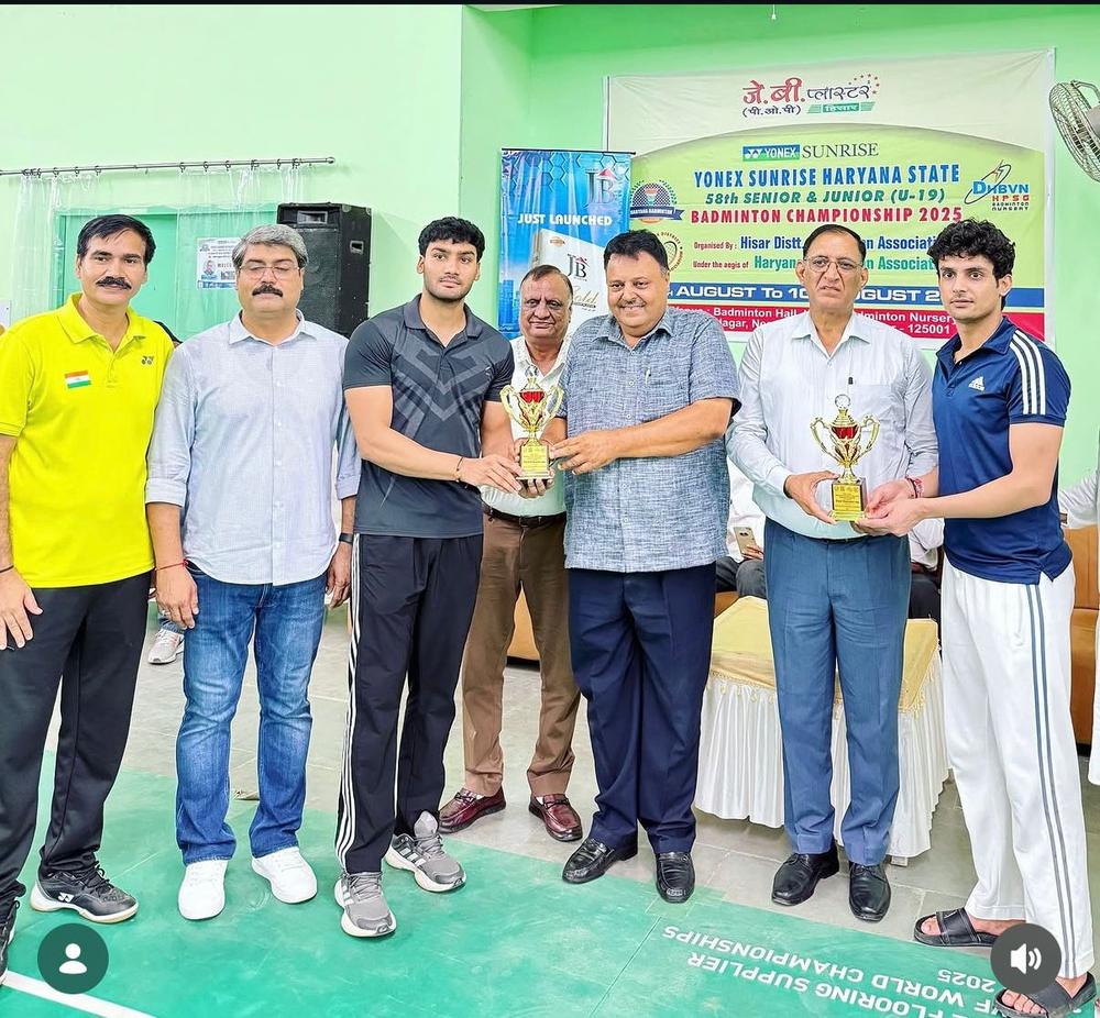 Lucky Brothers winning first prize at the Clash of the Titans badminton tournament